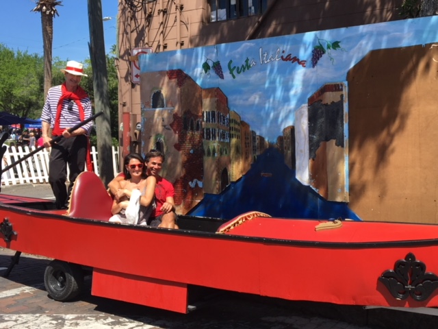 A couple enjoying a gondola ride at the Festa Italiana